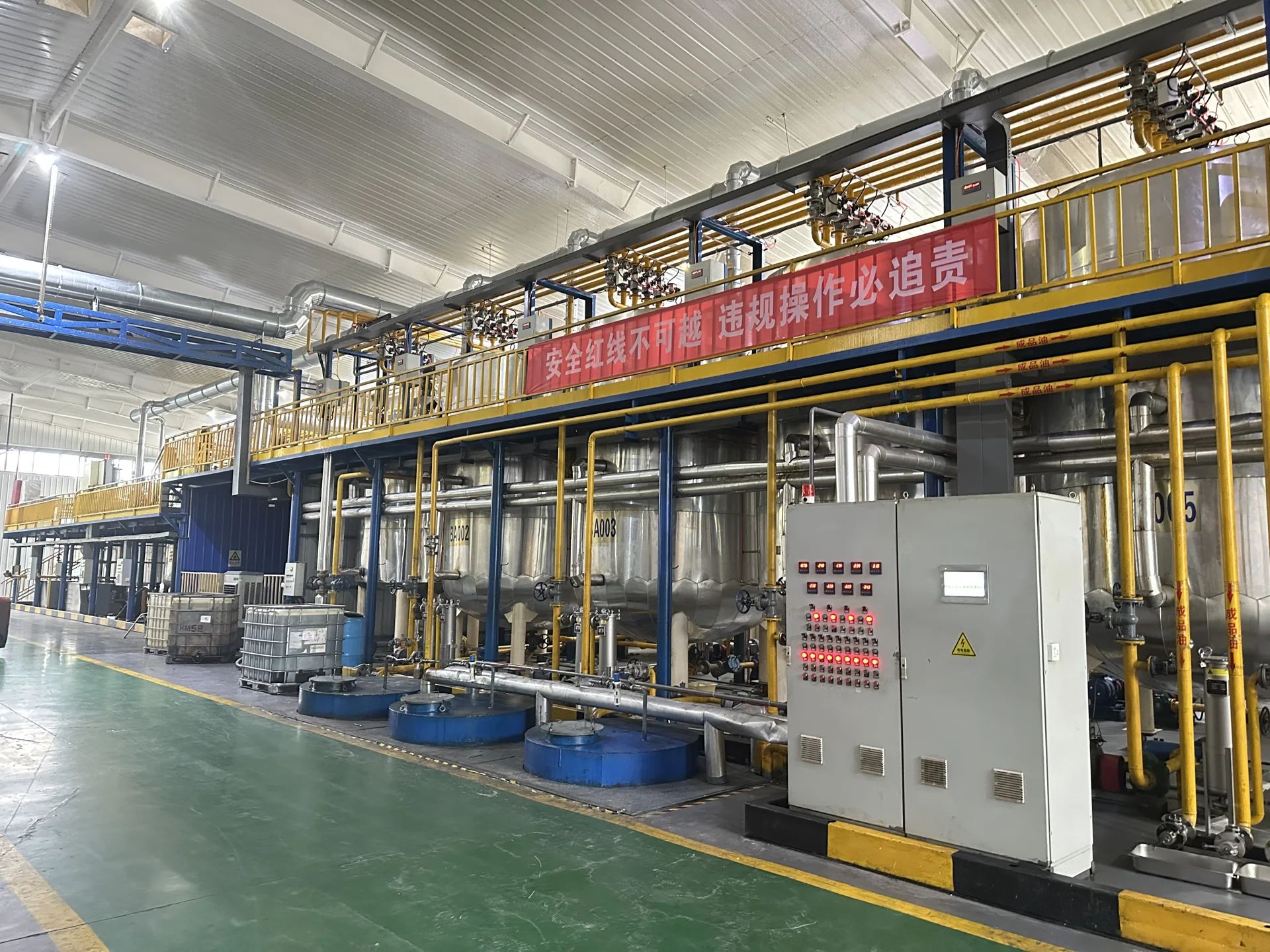 Production floor with blending vessels and pipework